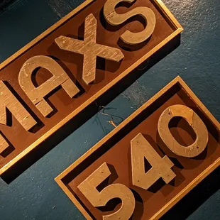 a close up of two wooden signs