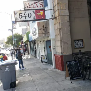 The old sign persists, the awning thankfully does not.