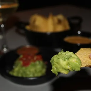 The Guacamole &amp; Chips are served with House ancho-chili salsa (we added queso to our chips order).