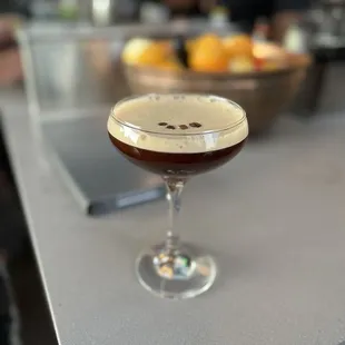 a glass of coffee on a counter