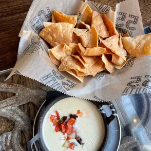 a bowl of quesadi and chips