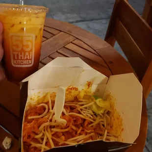 Pad Thai chicken with a Thai Iced Tea.