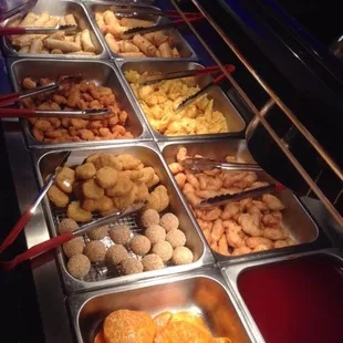 a variety of trays of food