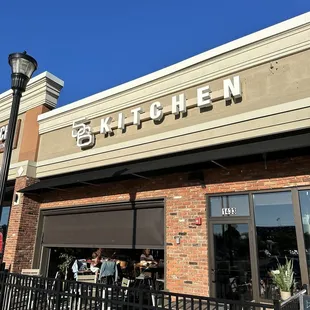 Exterior signage of the building and outdoor seating