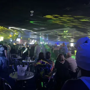 a crowd of people at a bar