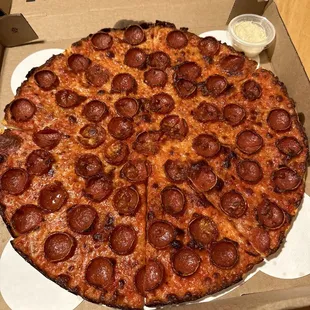 a pepperoni pizza in a box