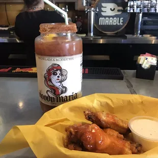 Naked Hot chicken wings and a Michelada ! Tasty!!