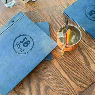 a table with drinks and menus