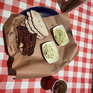 a plate of meat and sides