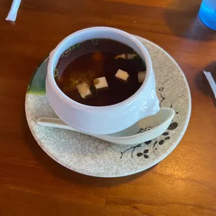 a bowl of soup on a plate
