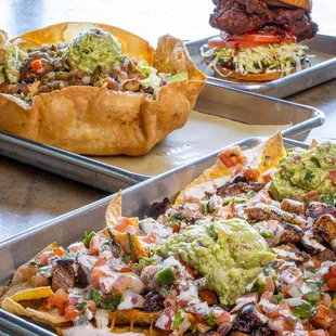 Nashville-style Hot Chicken Sandwich, Taco Salad, and Garbage Nachos.