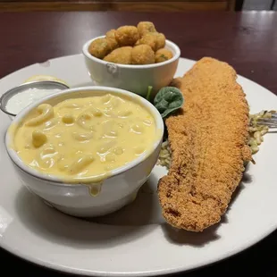Catfish with 2 sides and sauce.