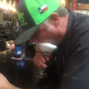 a man drinking a beer