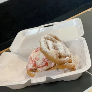 Brand new mini funnel cake slider with hand dipped strawberry short cake ice cream with powder sugar