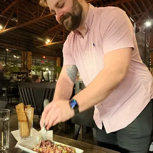 Zack mixing our beef tartare