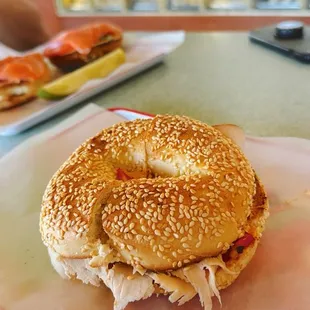 Sesame bagel toasted and scooped out with chipotle cream cheese +added turkey and bell peppers
