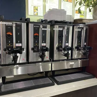 a row of coffee machines