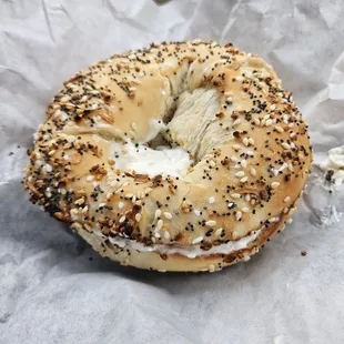 A toasted Everything Bagel with chive cream cheese.
