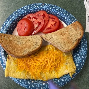 Meat filled omelet with Rye and tomatoes