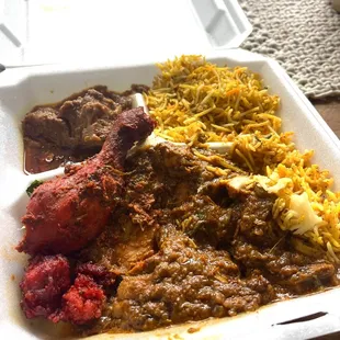 a styrofoam container of food