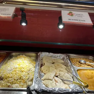 a variety of food items in a buffet