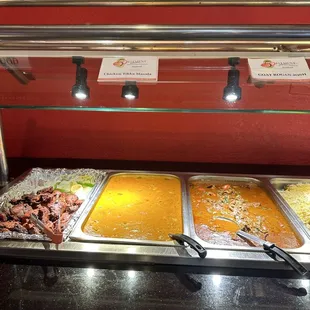 a variety of food items in a buffet