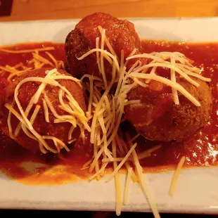 Arancini - goat cheese wrapped in risotto with tomato sauce you wish you could drink by the gallon!