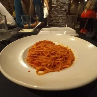 a plate of spaghetti on a table