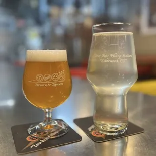 a glass of beer and a coaster