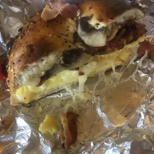 Bacon, egg and cheese on Everything bagel with sautéed veggies.
