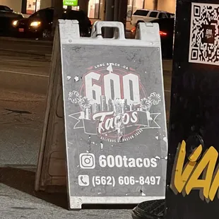 a sign on the side of the street