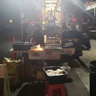 Owner preparing El pollo
