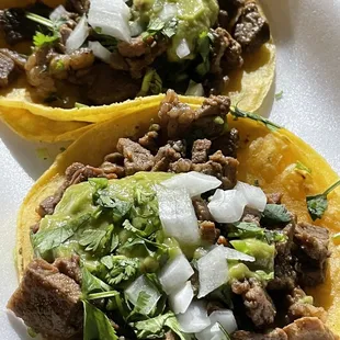 Asada tacos -- comes with cilantro, onion AND guacamole!