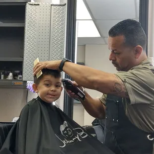 Gerardo making my son look handsome!!