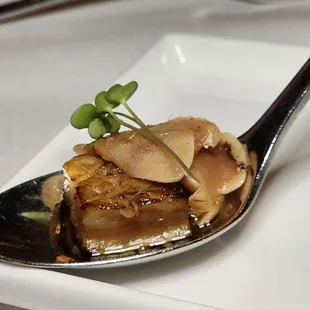 a spoon with food on it