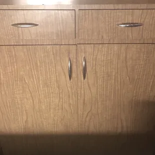 a close up of a wooden cabinet