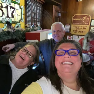 three people sitting at a table