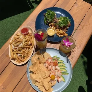 (Clockwise) Bacon Eggs Benedict, Shrimp Ceviche, Truffle Fries.