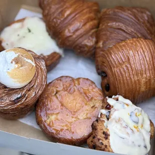 Ube cruffin, monkey queen, orange scone, butter croissants, chocolate croissant, sundried tomato/oaxacan cheese/chili croissant