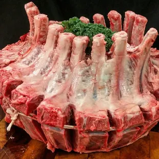 a large pile of raw meat on a cutting board