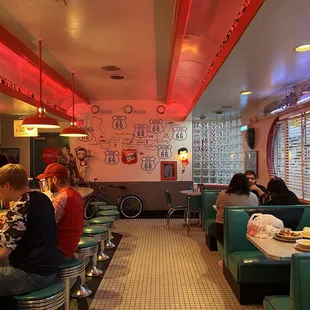 diners sitting at tables in a diner