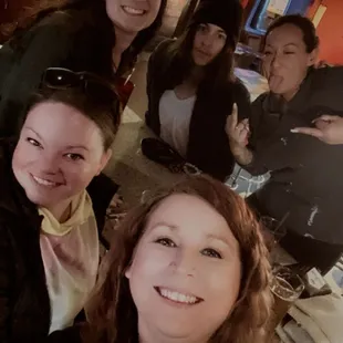 a group of women posing for a picture