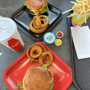 Yummy Veggie cheese burgers on a brioche bun w crispy tempura batter onion rings and crispy shoestring fries. IBC root beer is the best!