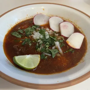 Birria plate. Half of my full order here. With onion, cilantro, radish, lime, and really hot yummy salsa.