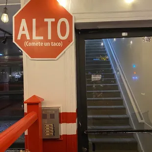 a stop sign and stairs