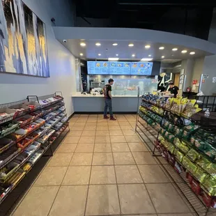 a woman standing in a grocery store