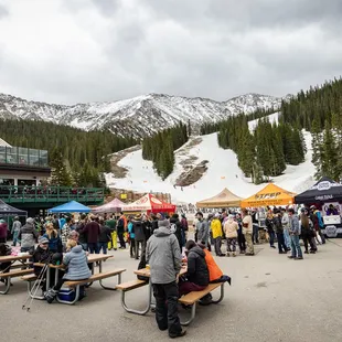 a crowd of people at a ski resort