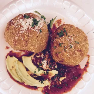 Risotto Milanese crab cakes with saffron puttanesca