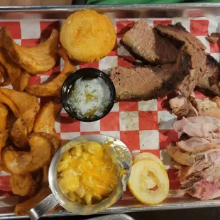Two meat combo (brisket and smoked chicken) with mac and cheese, fries, and cornbread