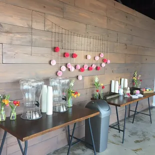 Coffee, tea, and water stations in the lobby for an event